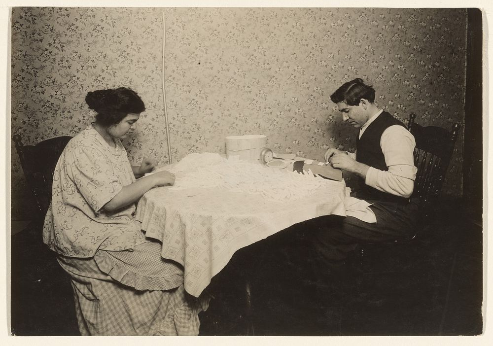 Couple Rolling Cigarettes in Tenement Home, N.Y. by Lewis W Hine