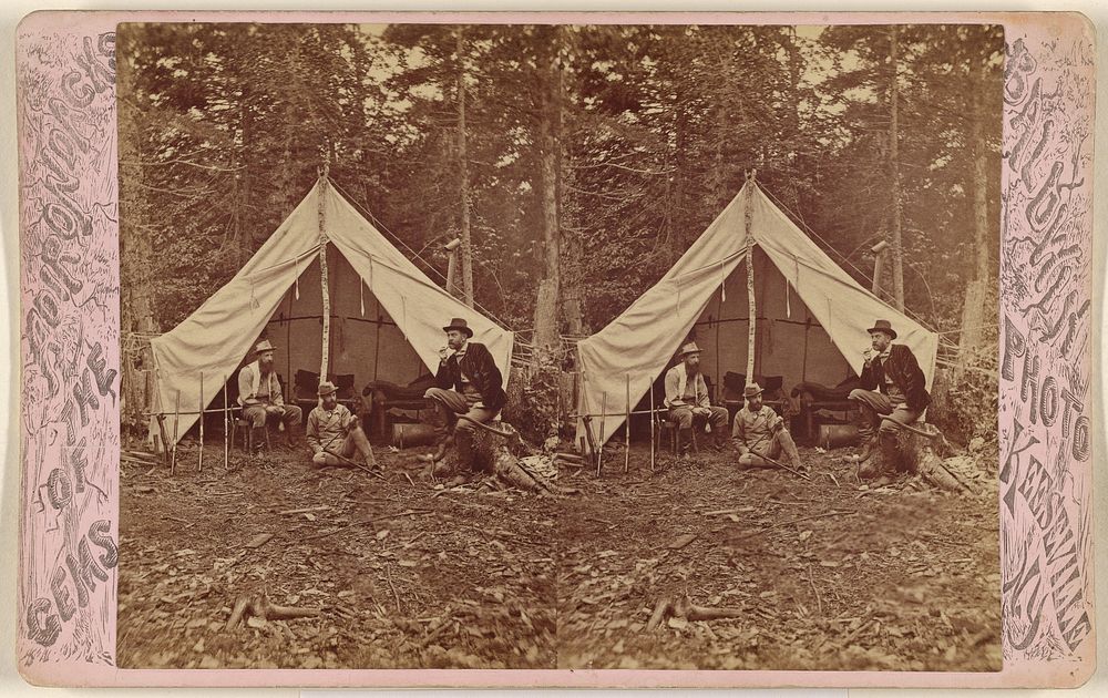 Group of beared men seated at campsite, tent in background by G W Baldwin