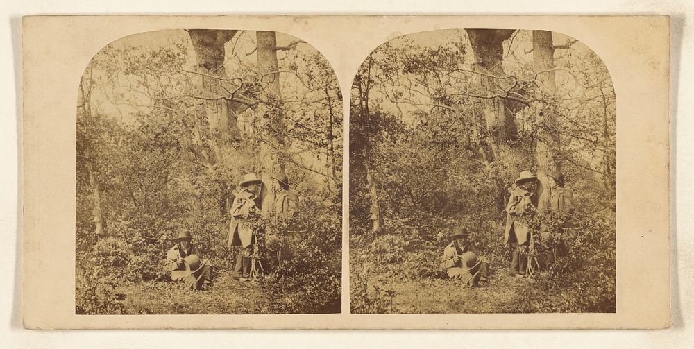 Three men in the woods, all with hats, two standing, one seated by William Grundy