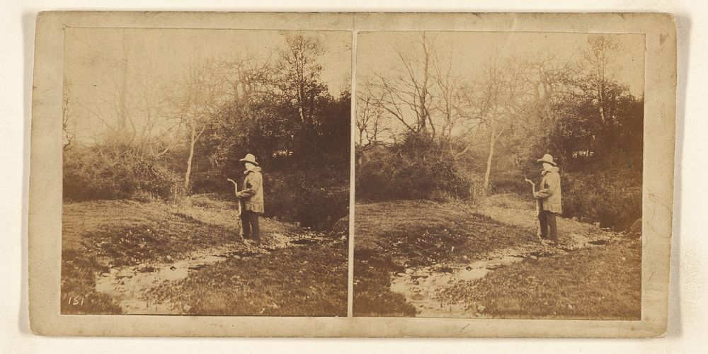 Man in hat walking down path holding a crooked stick by William Grundy