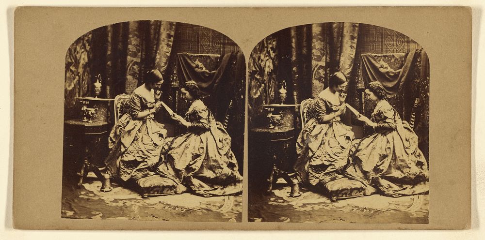 Two women seated looking at a letter by London Stereoscopic and Photographic Company