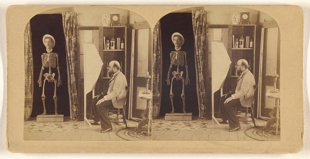 Bald, bearded man seated gazing at a human skeleton with a superimposed man's head wearing a straw hat