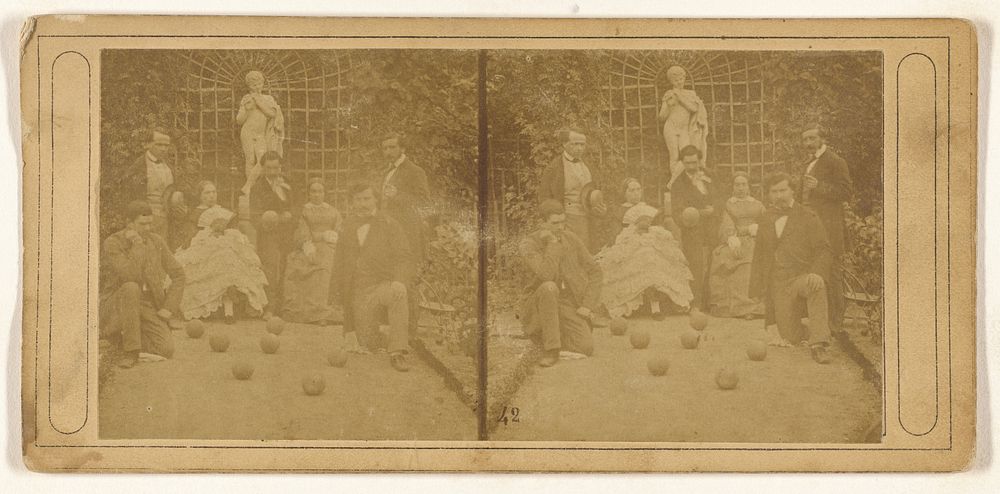Group of men and women playing bocce ball
