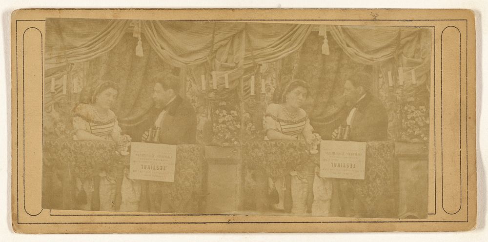 Man and woman in their box at an opera