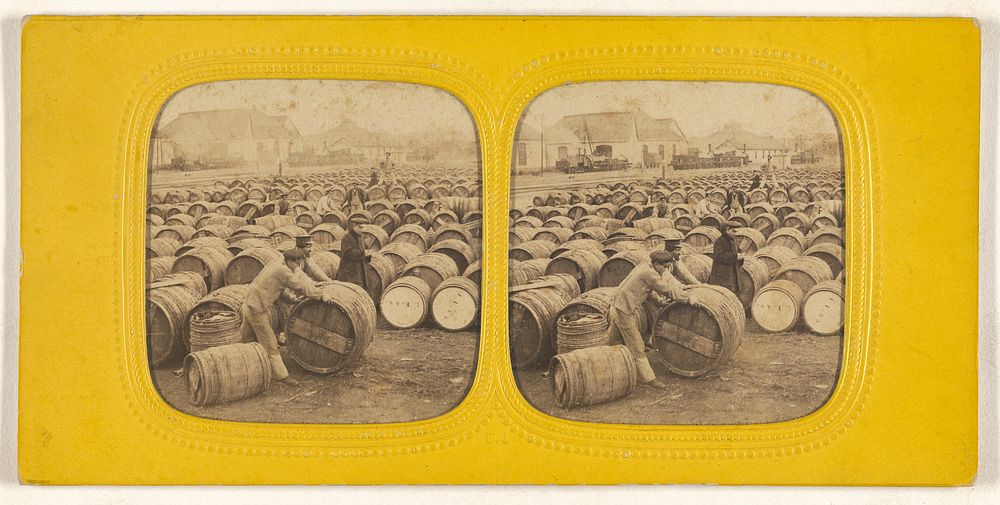 Men rolling a barrel in a field of barrels by E Lamy