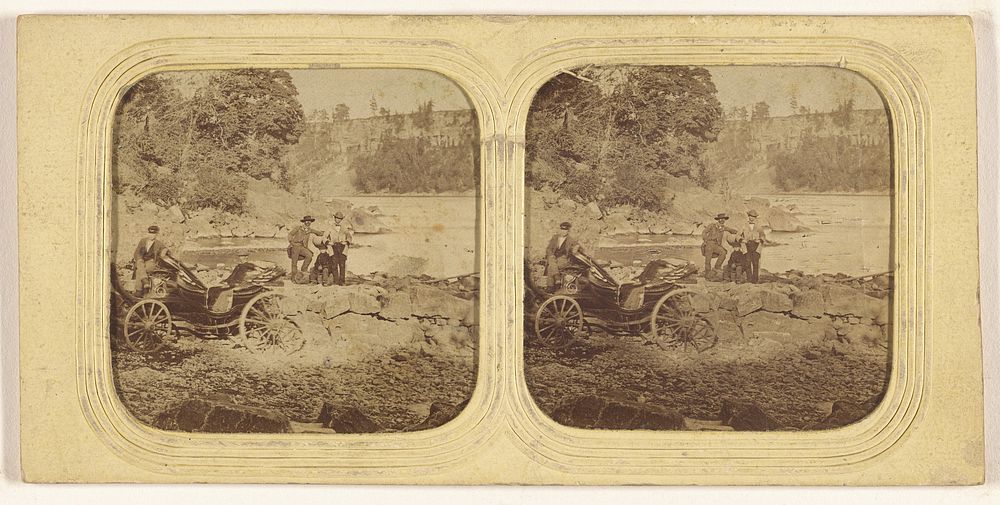 Men posed on rocks, another man posed by carriage
