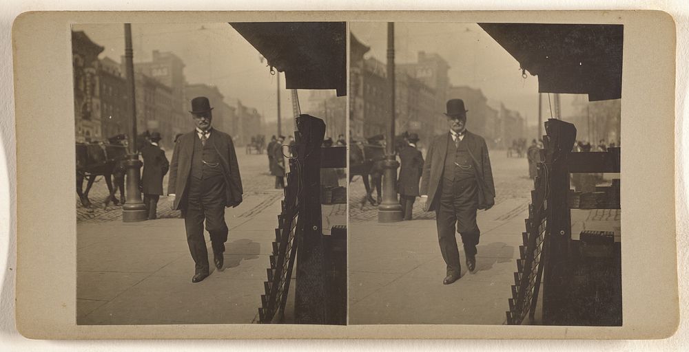 Man in derby walking down street, Albany, N.Y. by Julius M Wendt