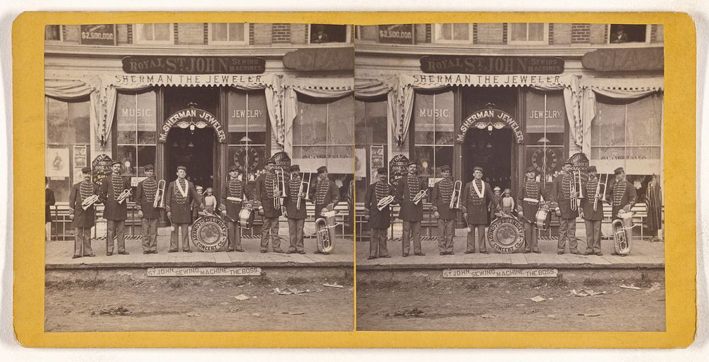 Musical group of Ed. Lindsey's Comedy Concert Co. posed in front of M. Sherman Jeweler store, possibly at Keene, New…