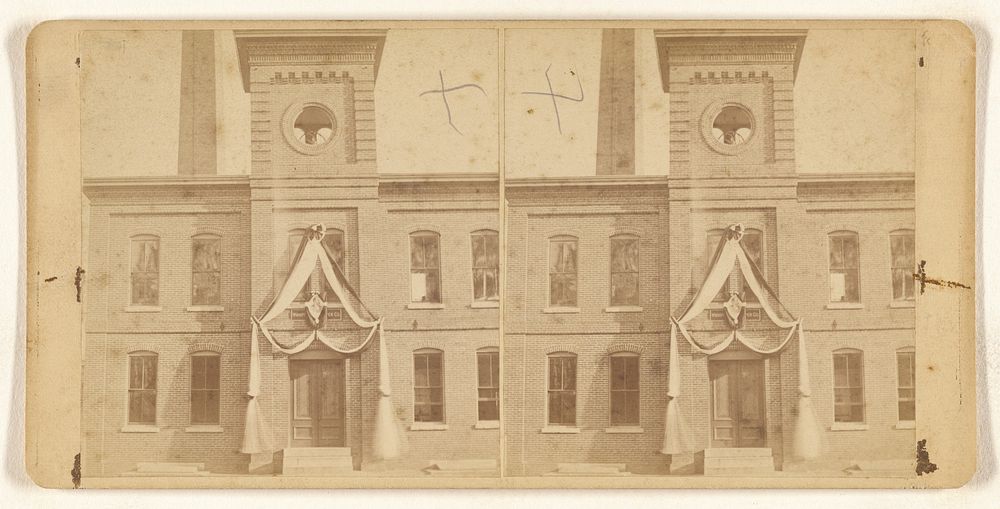 Exterior detail of Winninpeg Paper Co., with memorial photograph and wreath above front entrance