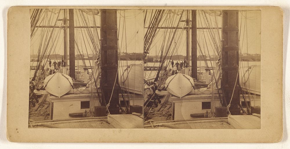 Deck view of a large sailboat, people in background