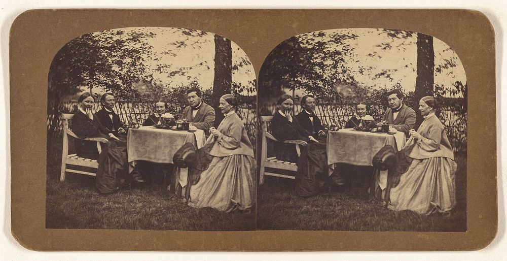 Group of five people seated at a table: three women and two men