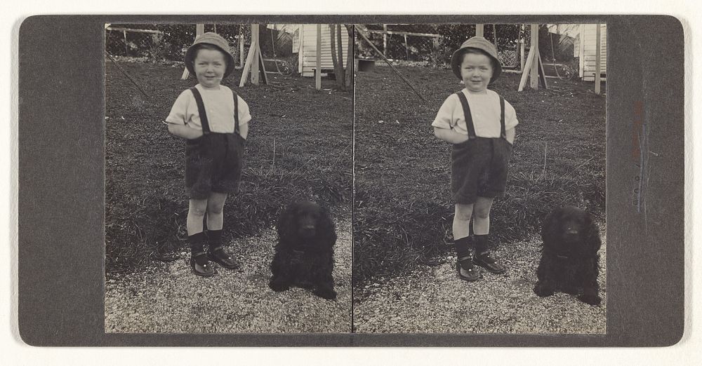 Unidentified little boy standing with dog on the lawn] (recto); A Kaffir Police Boy and Convict. Johannesburg, Transvaal…