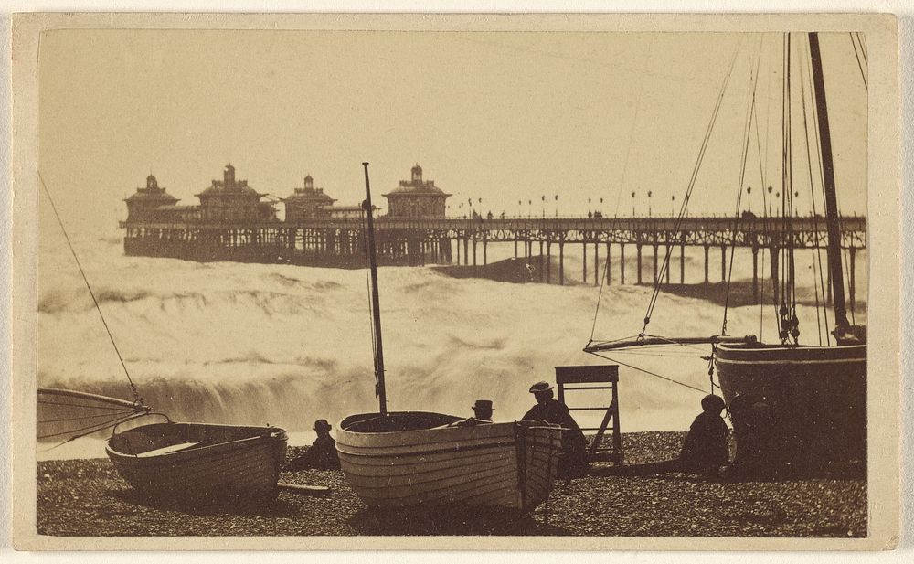 Beach view with pier, boats, and men at Brighton, England by William H Mason