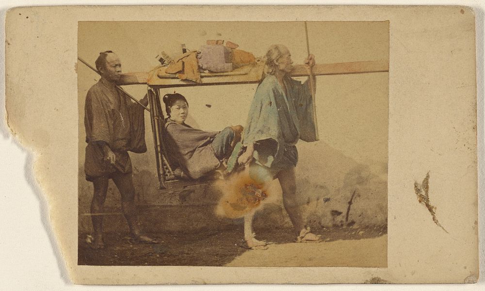 Japanese woman in a sedan, being carried by two men