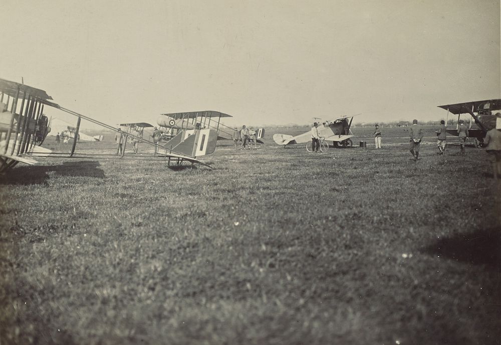 Airplanes in a field by Fédèle Azari
