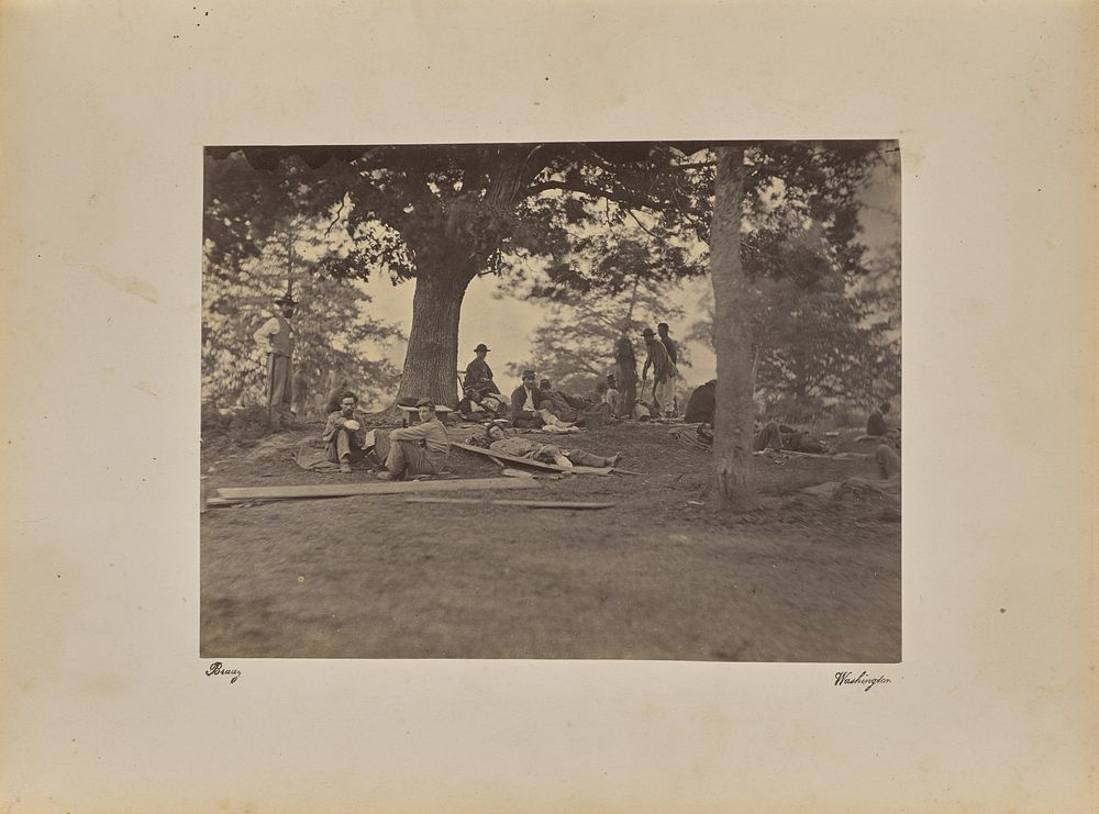 Wounded soldiers under trees, Marye's Heights, Fredericksburg. After the battle of Spotsylvania by Mathew B Brady