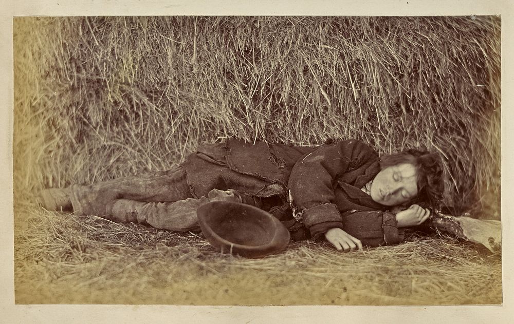 Boy sleeping next to haystack by Ronald Ruthven Leslie Melville