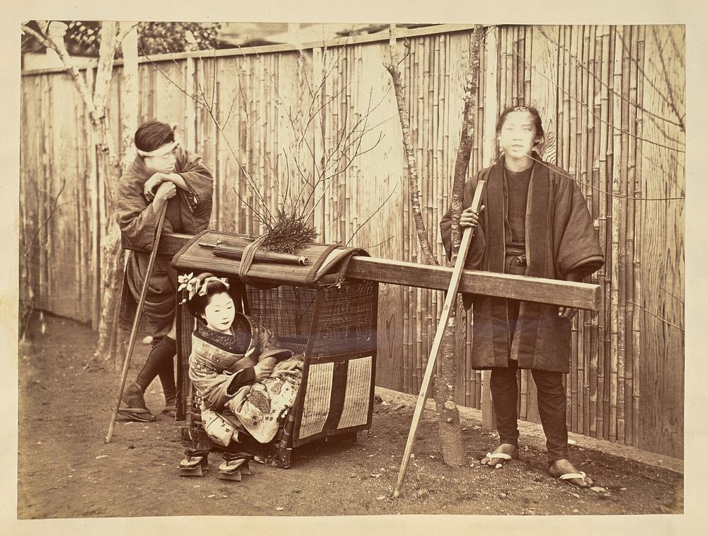 Woman in a palanquin with two carriers
