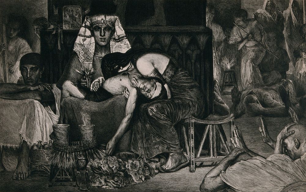 An Egyptian father holding the body of his dead young son in his lap while the mother of the boy buries her head in his lap.…