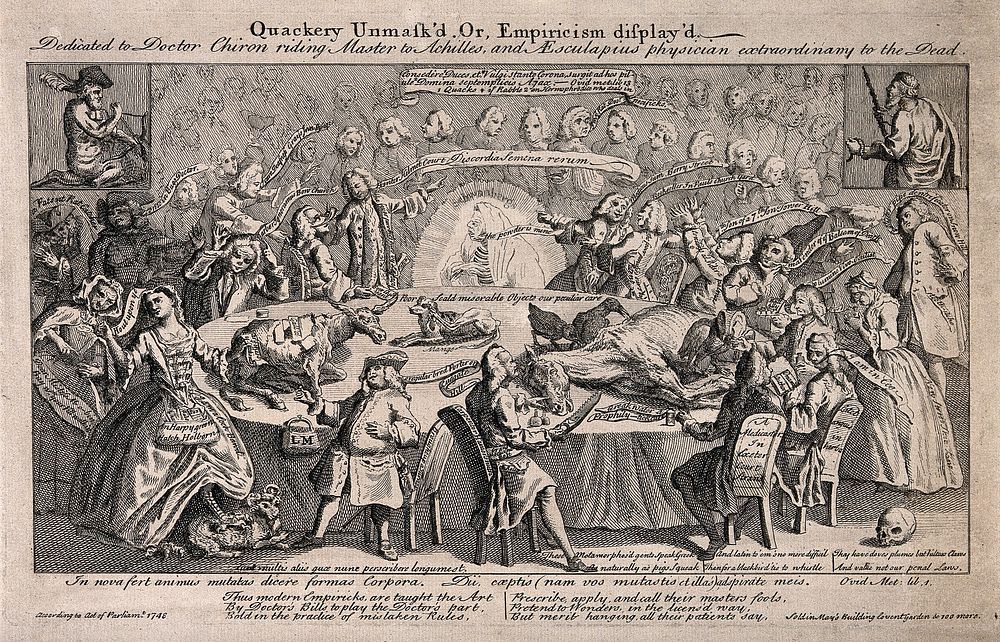 A large table in a lecture hall with many commercial medicine vendors and practitioners seated around it: in the background…