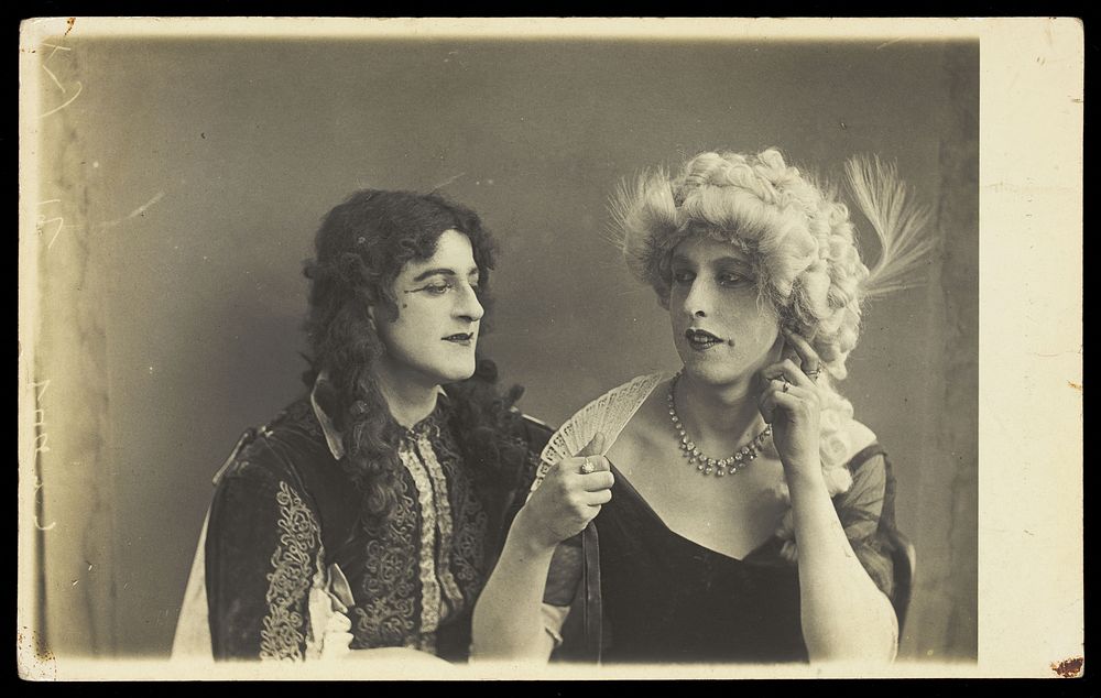 Two men in elaborate drag. Photographic postcard. 192--.
