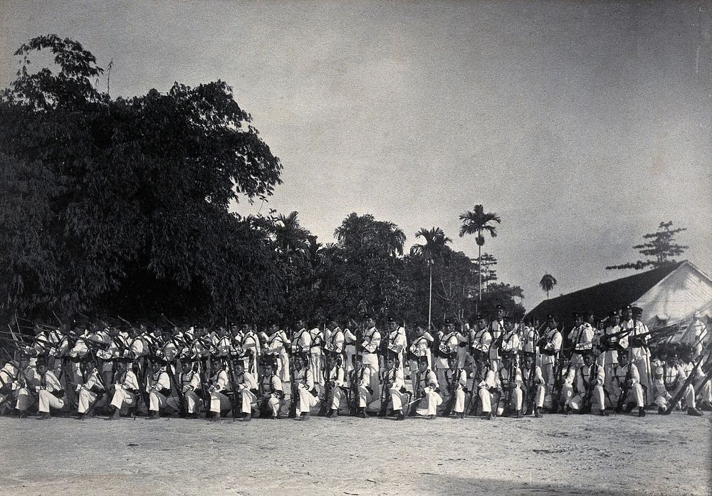 Sarawak: a line-up of armed Sarawak Rangers. Photograph.