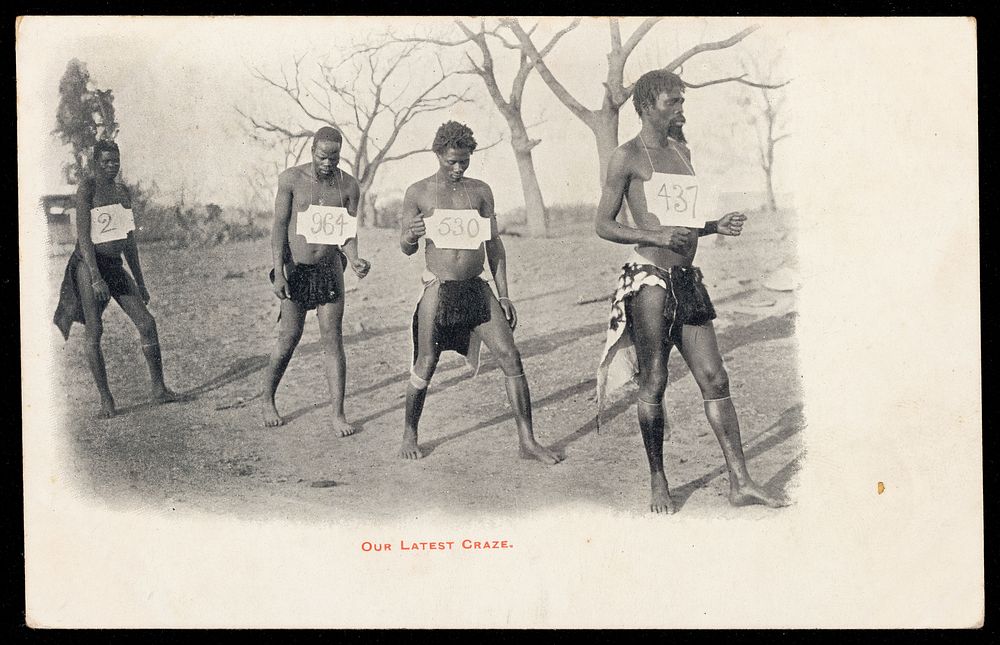 Four African men competing in a walking race.