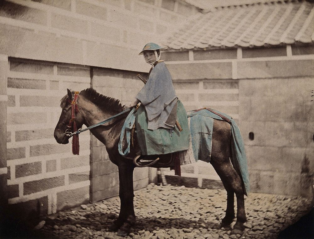 Japan: a child on a pony. Coloured photograph by Felice Beato, ca. 1868.
