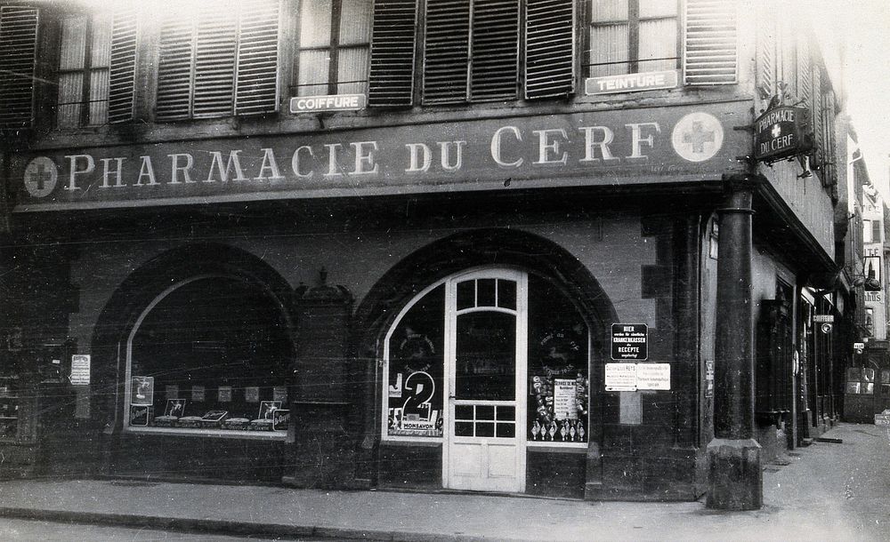 The front door of the Pharmacie du Cerf on the corner of the street, Strasbourg. Photograph.