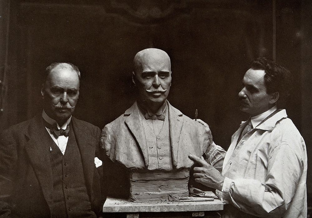 Sir Ronald Ross standing next to a bust of himself, and Janko Bragovitch (sculptor). Photograph by Grove, Son and Boulton…