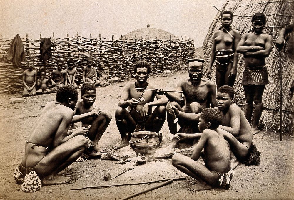 Africa: men of the Hlubi tribe eating. Albumen print.