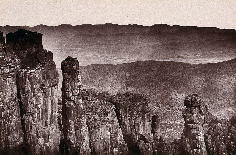 Valley of Desolation, South Africa: rock formations overlooking a barren valley near Graaff-Reinet. Woodburytype, 1888…