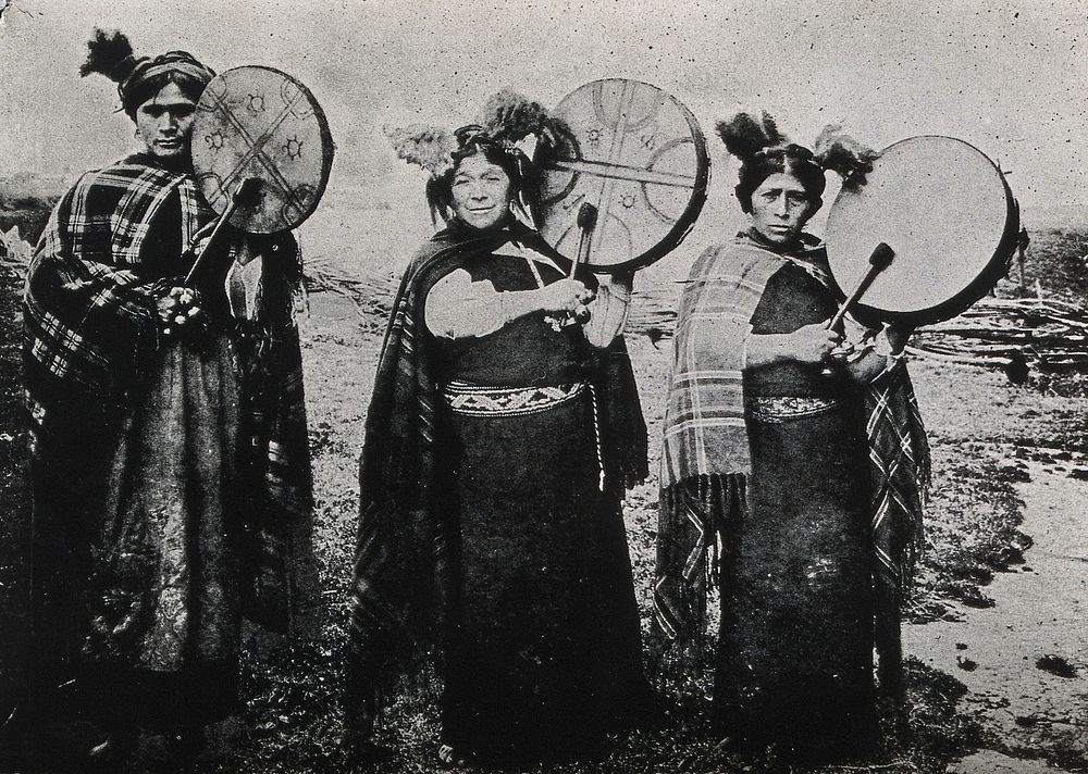 Three Mapuche women bearing drums. Photograph of a process print, ca. 1900.