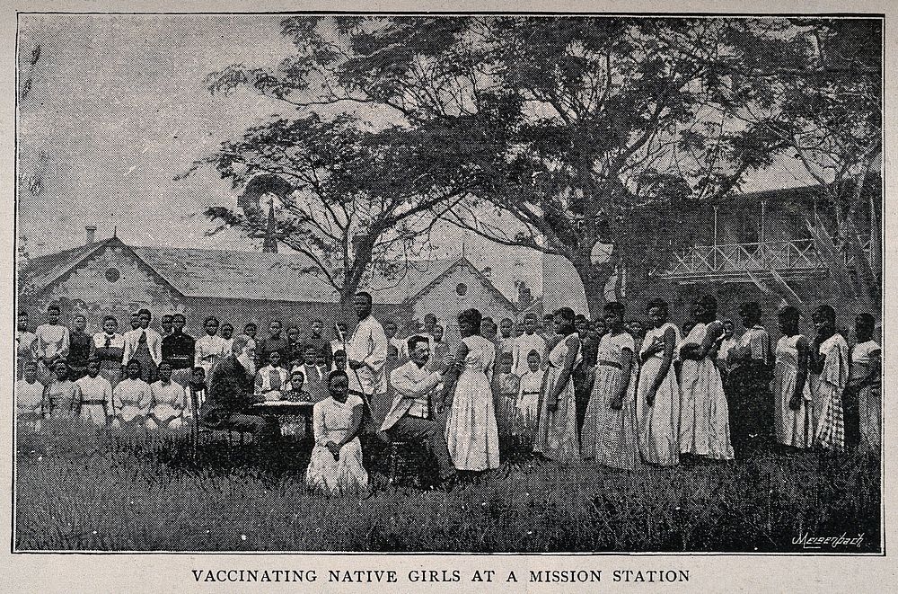 A white doctor vaccinating African girls all wearing European clothes at a mission station. Process print by Meisenbach…