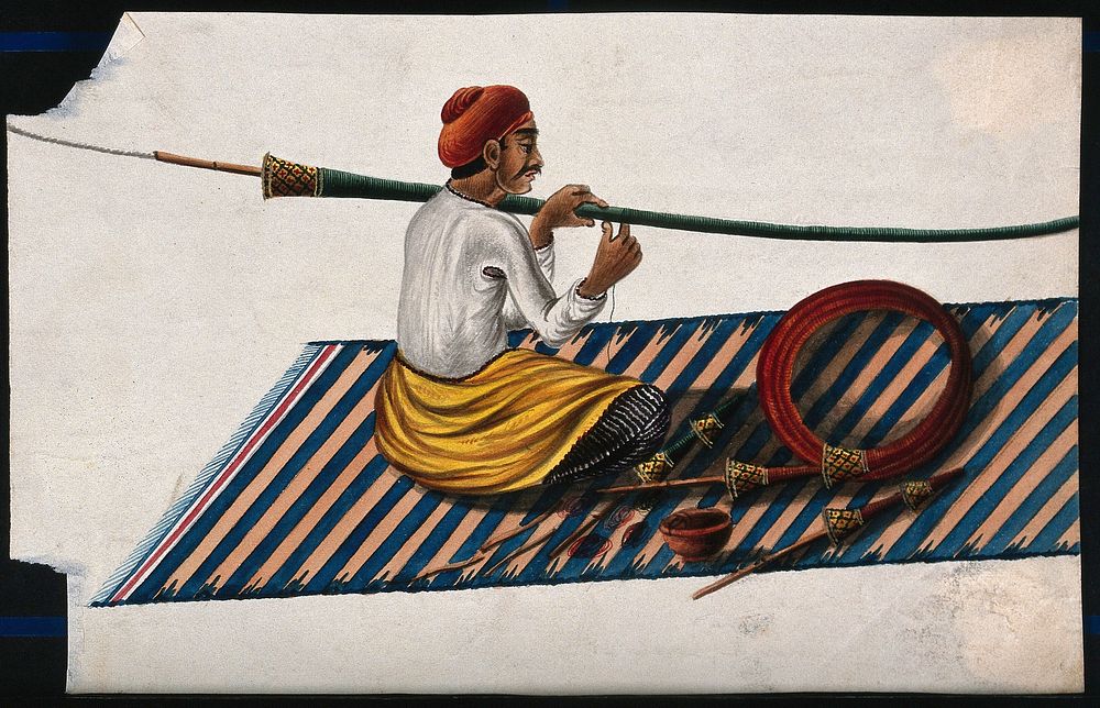 A man in the process of making or mending a hookah pipe. Gouache painting by an Indian painter.
