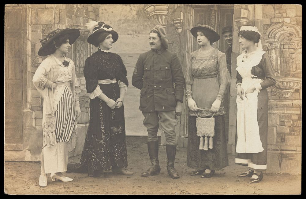 Prisoners of war performing a play at a prisoner of war camp in Cottbus. Photographic postcard, 191-.