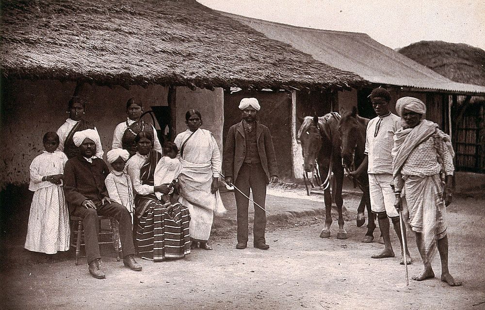 Umzinto, South Africa: a group of Indian and African servants. Woodburytype, 1888, after a photograph by Robert Harris.