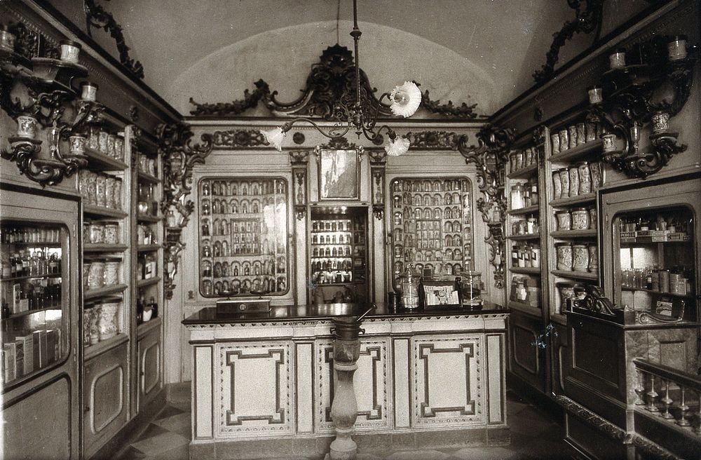 The ornate sixteenth-century pharmacy of S. Maria della Scala, Sorrento: interior with decorated bench and a large mortar in…