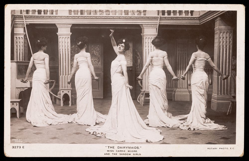 Miss Carrie Moore and the Sandow girls performing as "The Dairymaids". Photographic postcard, 1906.