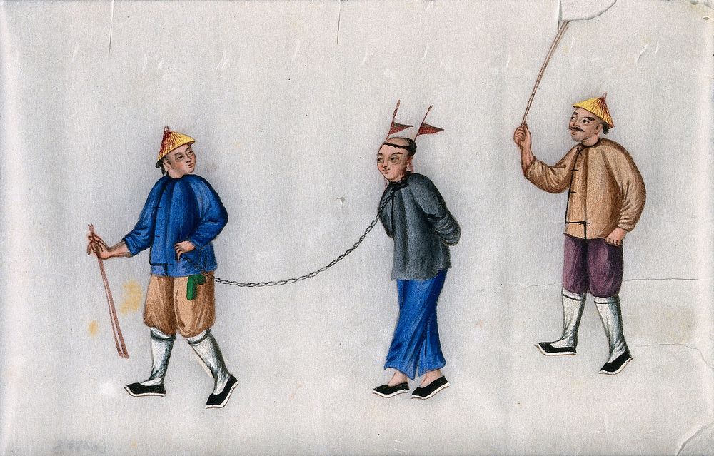 A Chinese man, with hands tied behind his back and a chain attached to his neck, is led by one man, while another hits him…