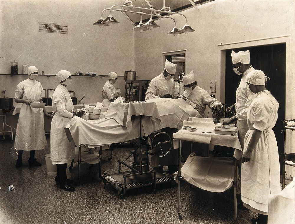 An operating theatre: surgical staff performing an operation. Photograph, ca. 1970.