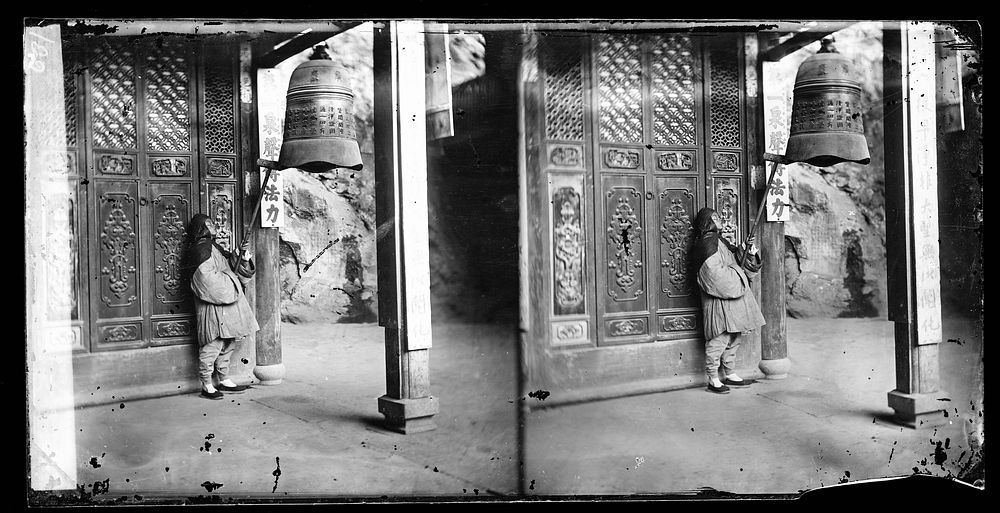 Fangguangyan monastery, Fujian province, China: a monk ringing the bell. Photograph by John Thomson, 1870-1871.