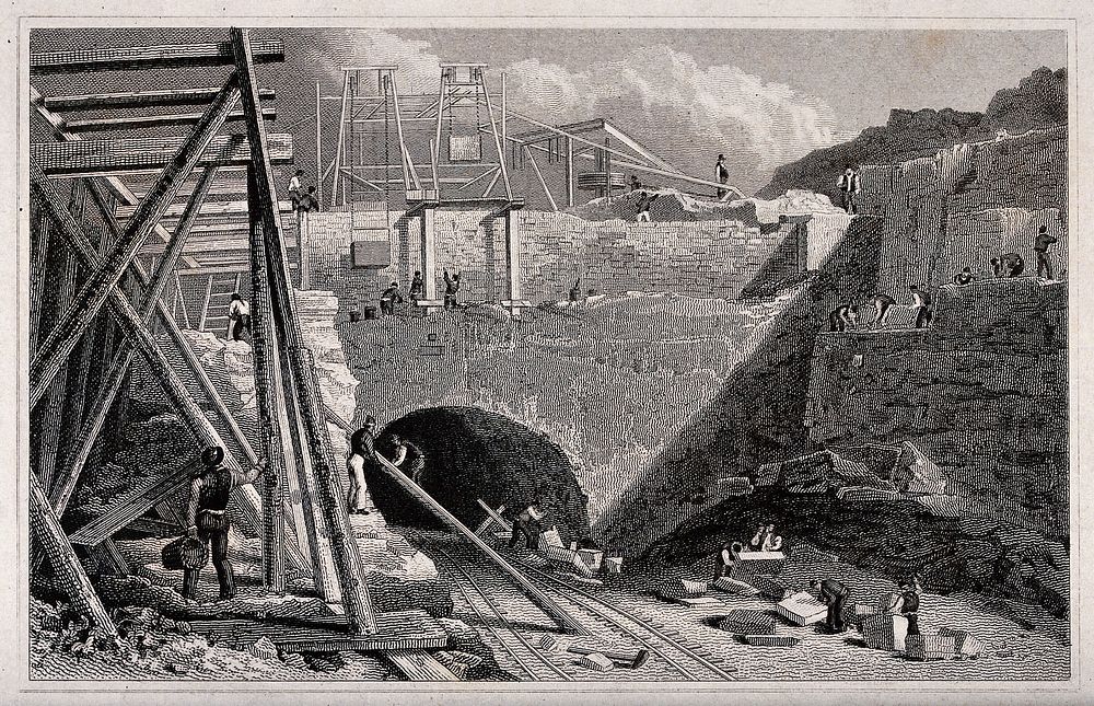 Liverpool: a railway tunnel cut into the mountain side with men working on scaffolding above and cutting stone below.…