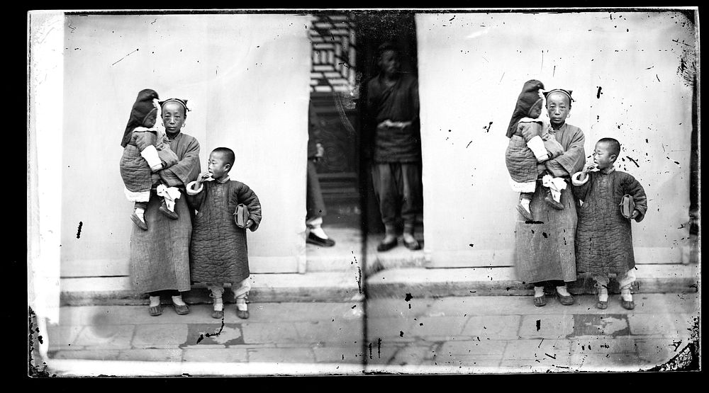 Peking, Pechili province, China: a mother with two children. Photograph by John Thomson, 1869.