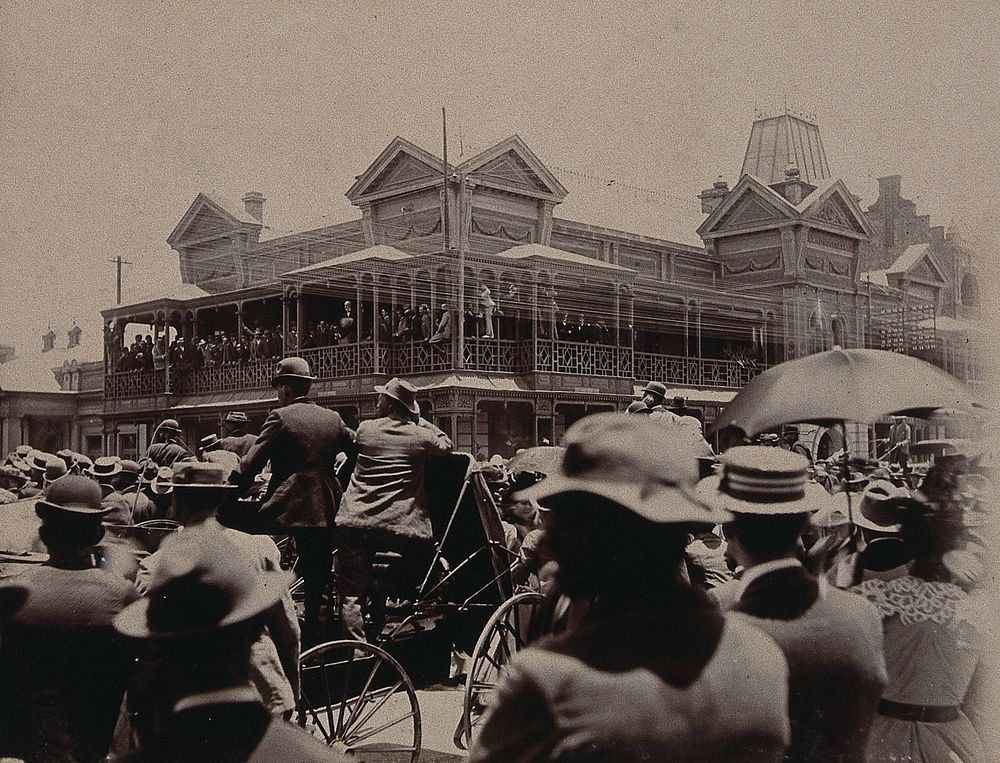 South Africa: a large crowd of people gathered outside a building in Johannesburg. 1896.