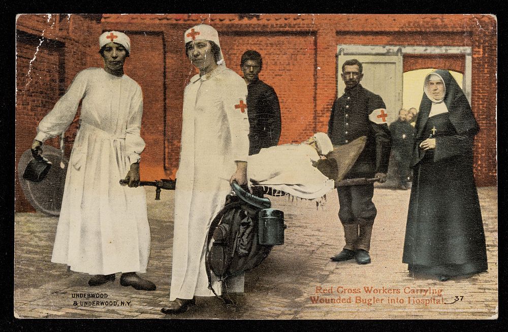Red Cross workers carrying wounded bugler into hospital / Underwood & Underwood, N.Y.