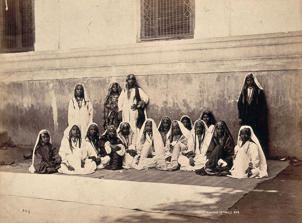 Kashmiri women in traditional dress: group portrait. Photograph, ca. 1900.