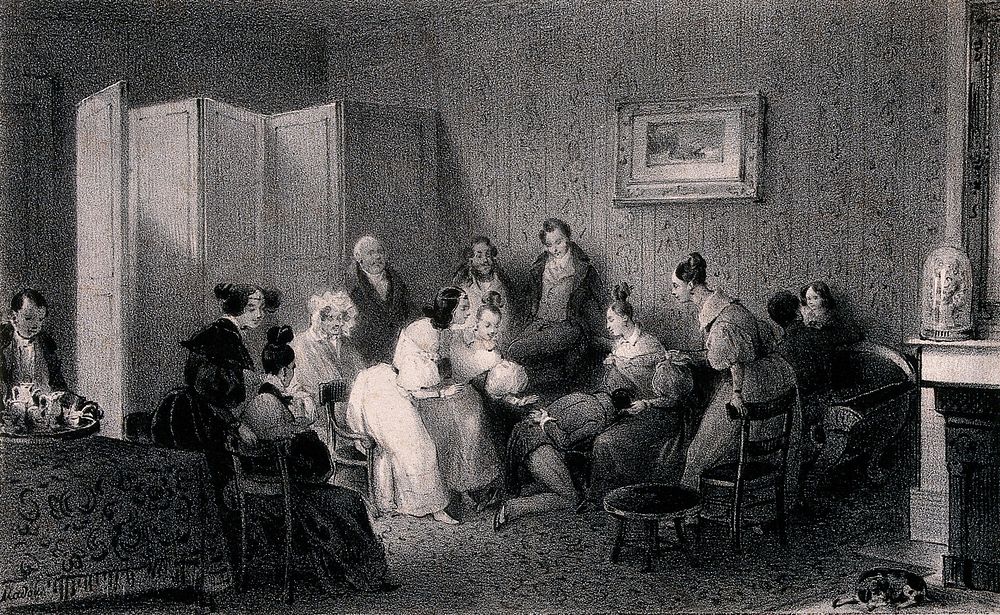A group of men and women who appear to be playing a parlour game with a man's head in a lady's lap. Lithograph by de C.…