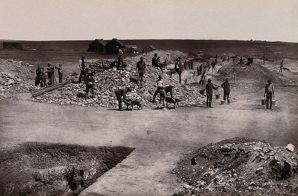 South Africa: miners at the main reef workings of the Ferreira Gold Mining Company. Woodburytype, 1888, after a photograph…