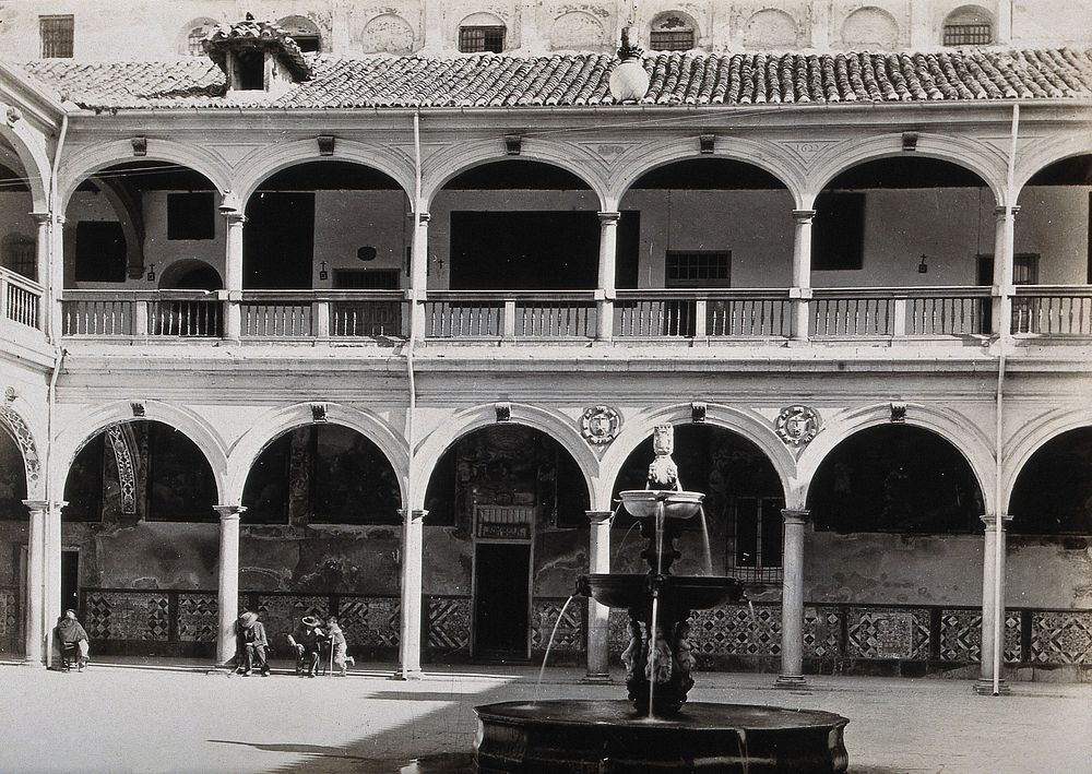 Hospital San Juan de Diós, Granada: view of the cloister and fountain . Photograph, ca.1900.